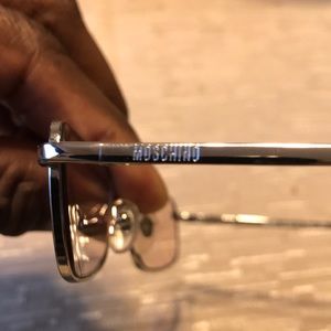 Silver Moschino Frames.  Light blue tint.